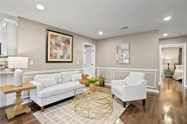 1684 Braeburn Dr SE, Atlanta, GA 30316 - living room with wood finished floors, a wainscoted wall, recessed lighting, and a decorative wall