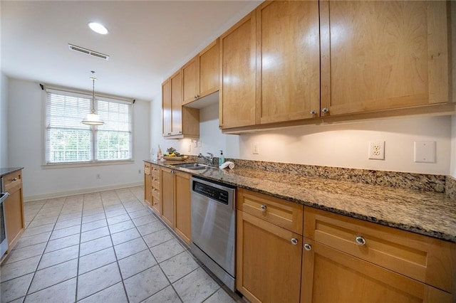 kitchen featuring light tile patterned floors, visible vents, dishwasher, stone counters, and a sink