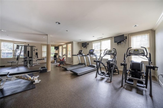 exercise room with a wealth of natural light, baseboards, and recessed lighting