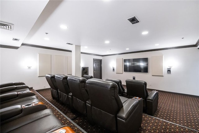 home theater room featuring dark colored carpet, crown molding, and recessed lighting