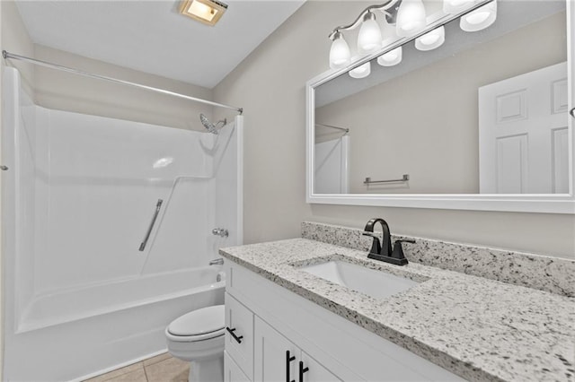 full bathroom featuring toilet, tile patterned floors, bathing tub / shower combination, and vanity