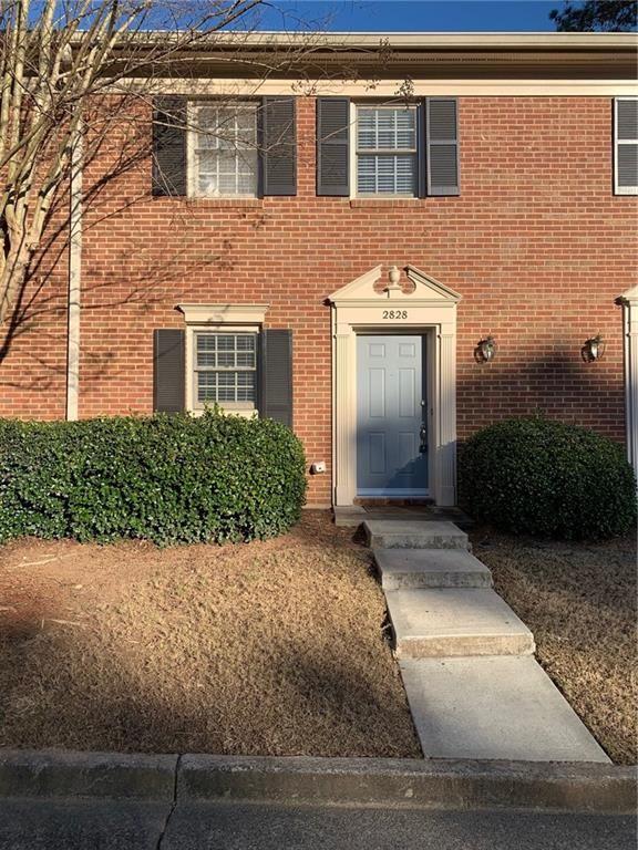 property entrance with brick siding