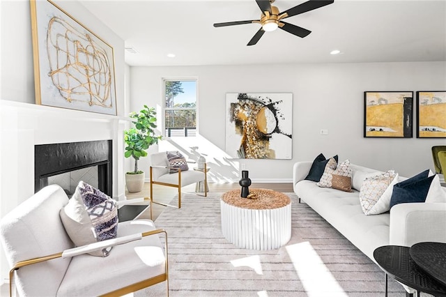 living room featuring ceiling fan and wood-type flooring