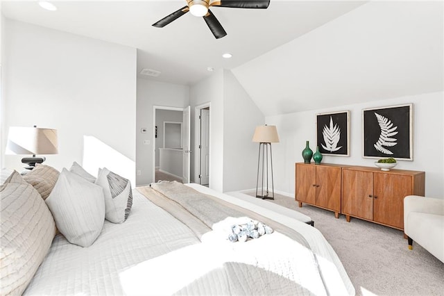 bedroom with ceiling fan, lofted ceiling, and light carpet