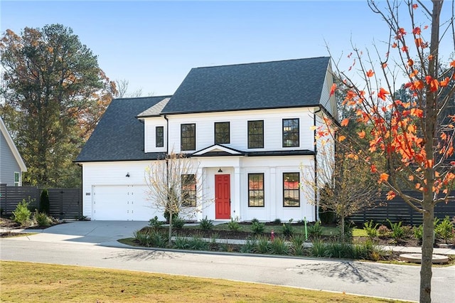 view of front of property with a front lawn and a garage