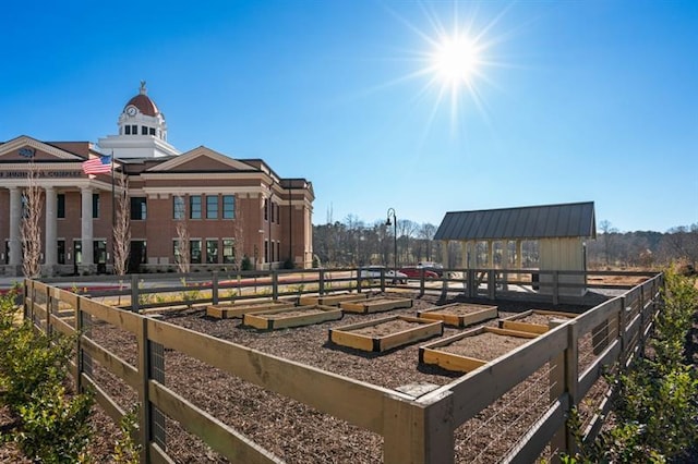 view of property's community featuring an outbuilding