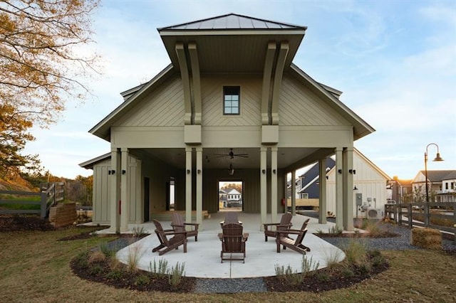 back of property featuring a patio area and ceiling fan