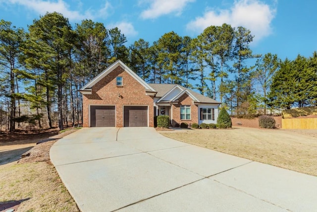 view of front of property featuring a front yard and a garage