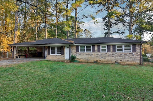 ranch-style house with a front yard and a carport