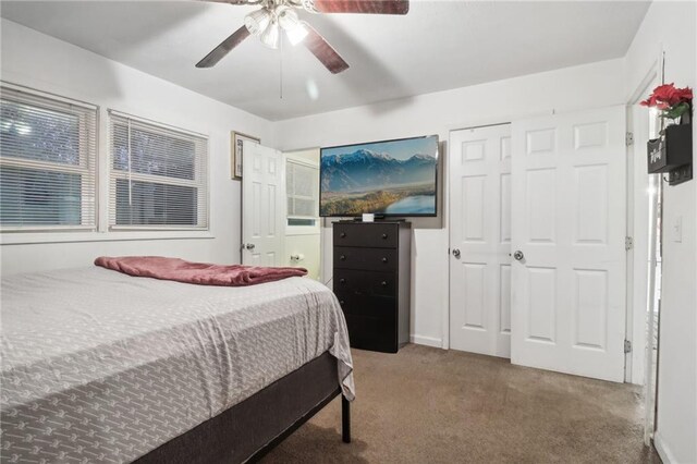 carpeted bedroom with ceiling fan