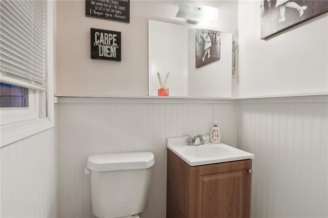 bathroom featuring vanity and toilet