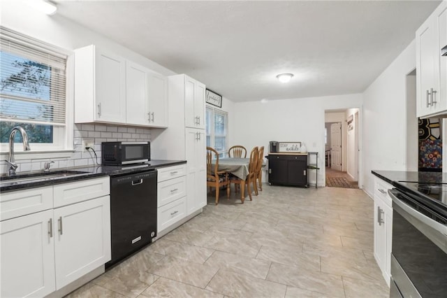 kitchen with backsplash, dark stone counters, black appliances, sink, and white cabinetry