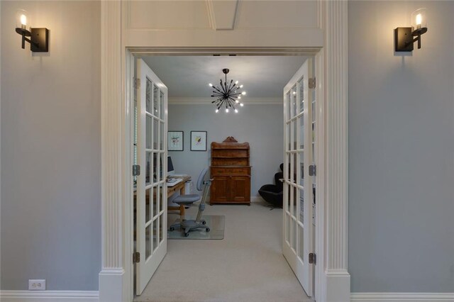 office area featuring french doors, ornamental molding, carpet, and a chandelier