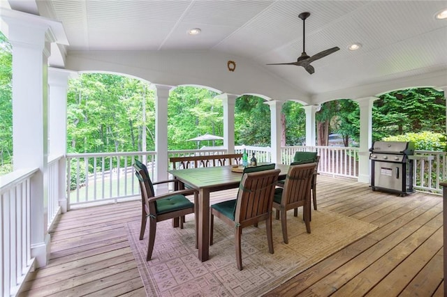 deck featuring area for grilling and ceiling fan