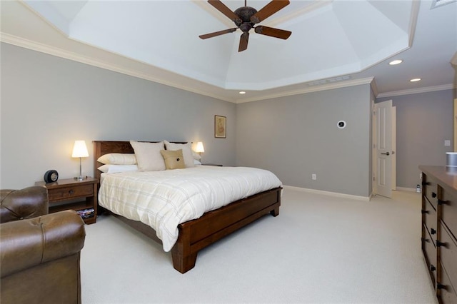 bedroom with light carpet, recessed lighting, baseboards, a tray ceiling, and ornamental molding