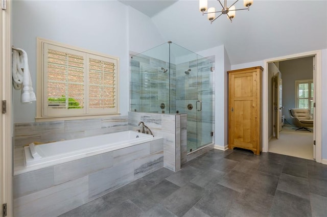 full bath featuring vaulted ceiling, a shower stall, a bath, and a chandelier