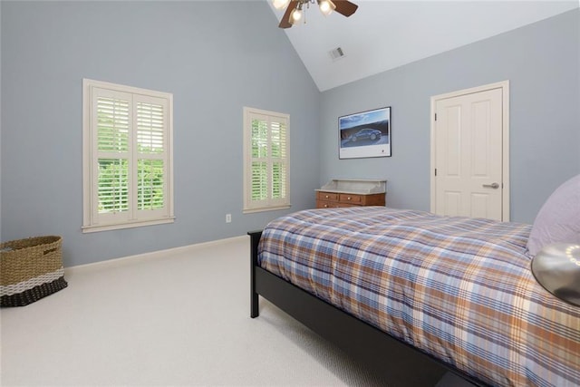 bedroom with carpet floors, visible vents, baseboards, ceiling fan, and high vaulted ceiling