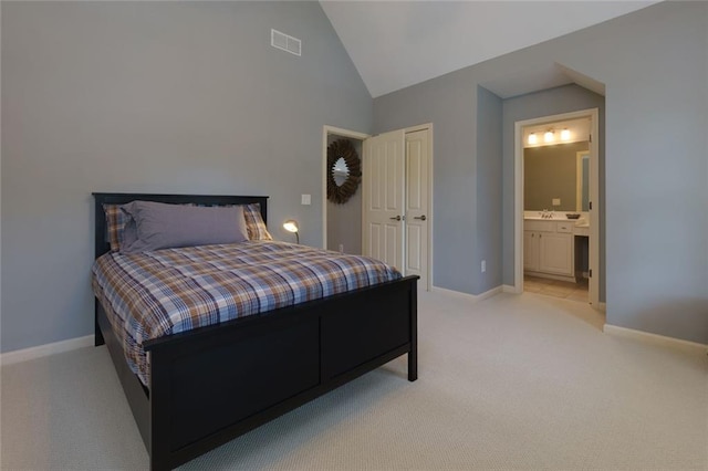 bedroom with baseboards, visible vents, light carpet, and lofted ceiling