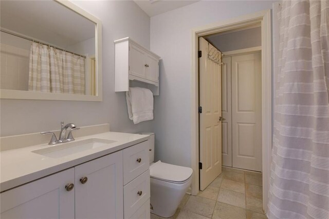 full bath with toilet and vanity
