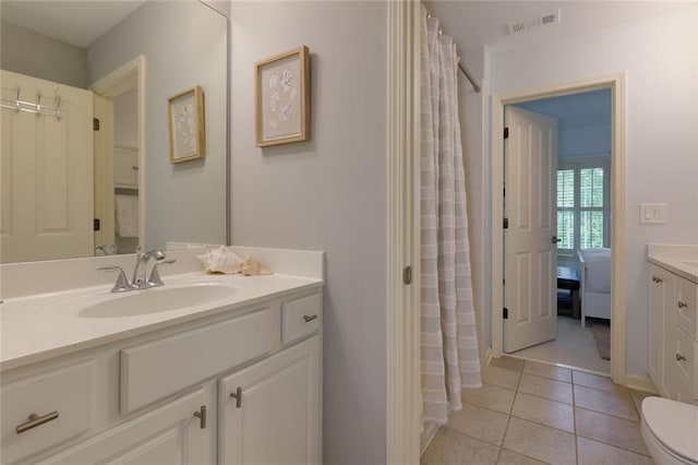 bathroom featuring vanity, tile patterned flooring, visible vents, toilet, and a shower with shower curtain