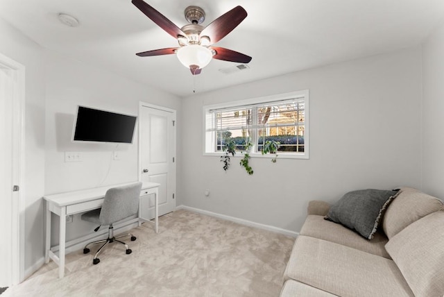 office with baseboards, a ceiling fan, visible vents, and light colored carpet