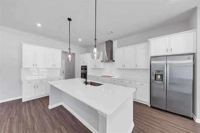 212 Birchwood Row, Canton, GA 30115 - kitchen with appliances with stainless steel finishes, wall chimney range hood, a sink, decorative backsplash, and dark wood finished floors