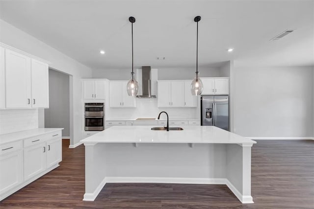 212 Birchwood Row, Canton, GA 30115 - kitchen with appliances with stainless steel finishes, wall chimney range hood, baseboards, decorative backsplash, and recessed lighting