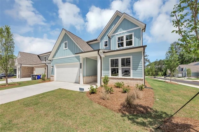212 Birchwood Row, Canton, GA 30115 - craftsman house featuring board and batten siding, driveway, a front yard, a garage, and brick siding