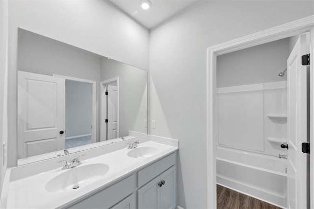 212 Birchwood Row, Canton, GA 30115 - bathroom featuring double vanity,  shower combination, and wood finished floors