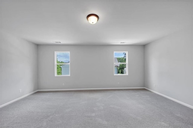 212 Birchwood Row, Canton, GA 30115 - carpeted spare room with baseboards