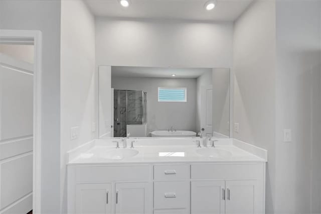 212 Birchwood Row, Canton, GA 30115 - bathroom featuring a stall shower, double vanity, and recessed lighting