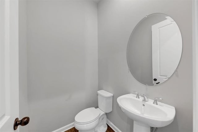 212 Birchwood Row, Canton, GA 30115 - bathroom featuring a sink, toilet, baseboards, and wood finished floors