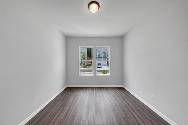 212 Birchwood Row, Canton, GA 30115 - unfurnished room featuring dark wood-type flooring and baseboards