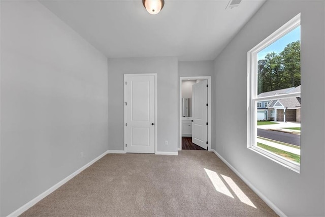 212 Birchwood Row, Canton, GA 30115 - unfurnished bedroom featuring carpet floors, baseboards, and ensuite bath