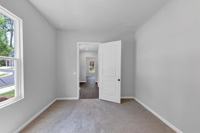 212 Birchwood Row, Canton, GA 30115 - unfurnished room with plenty of natural light, carpet flooring, and baseboards