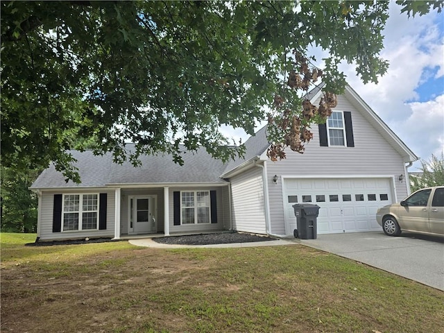 view of front of home featuring a garage and a front lawn