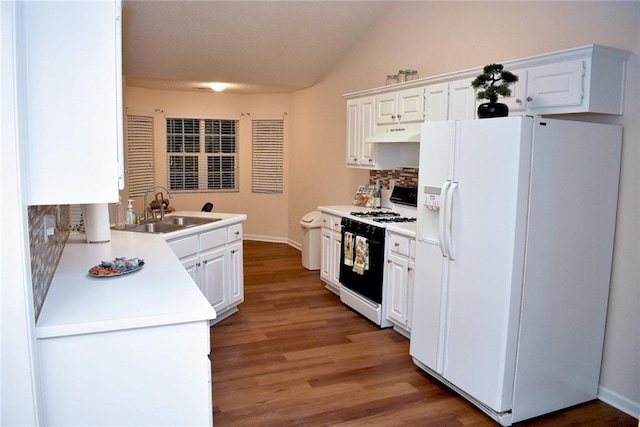 kitchen featuring dark wood-type flooring, sink, white cabinets, white appliances, and premium range hood