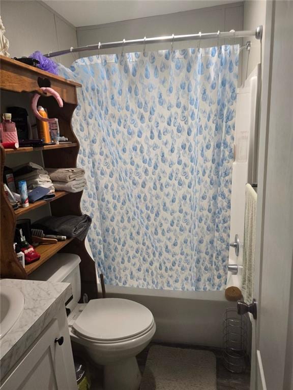 full bathroom with vanity, shower / bath combo with shower curtain, and toilet