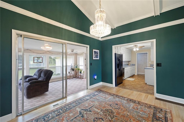 191 Durham St, Dallas, GA 30132 - doorway featuring light wood-style floors, a chandelier, crown molding, baseboards, and ceiling fan