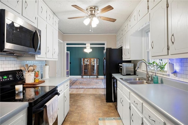 191 Durham St, Dallas, GA 30132 - kitchen featuring black appliances, a sink, light countertops, white cabinetry, and a textured ceiling