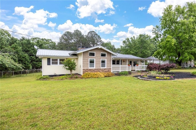 191 Durham St, Dallas, GA 30132 - back of house featuring a porch, stone siding, and metal roof