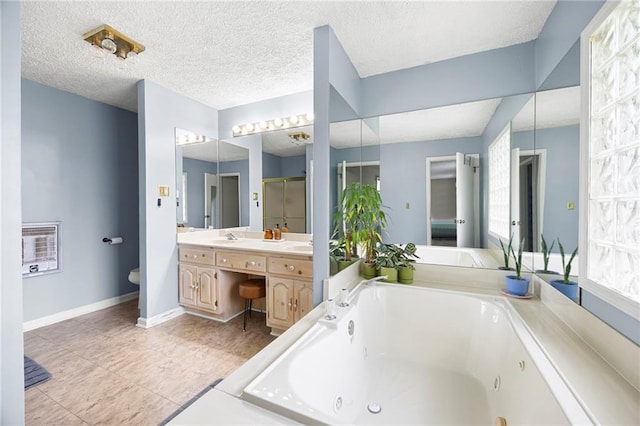 191 Durham St, Dallas, GA 30132 - bathroom with a tub with jets, a shower stall, tile patterned floors, double vanity, and baseboards