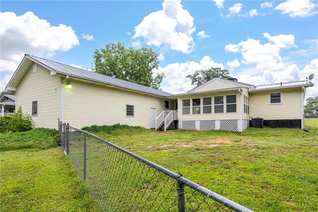 191 Durham St, Dallas, GA 30132 - rear view of house featuring metal roof and central AC unit