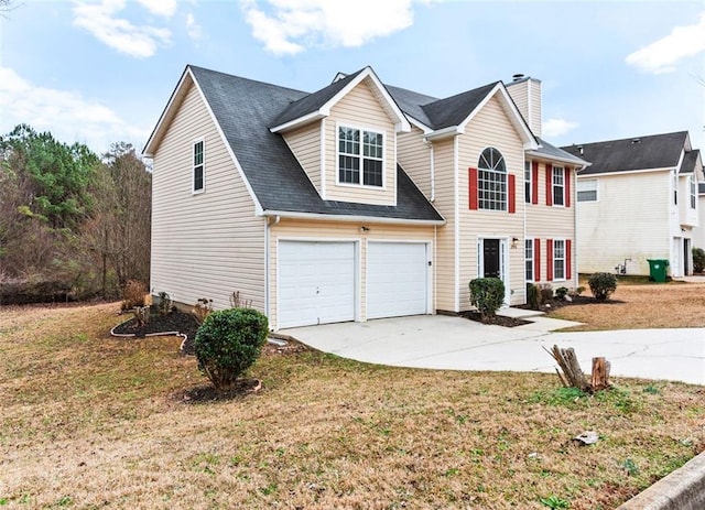 view of front of property featuring a garage and a front lawn