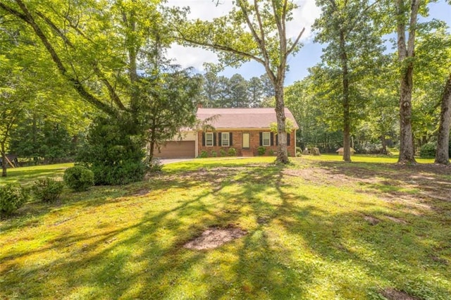 1434 Culpepper Rd, Calhoun, GA 30701 - view of front of home with a garage, a front lawn, and brick siding