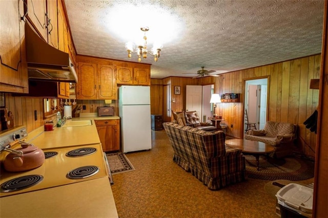 1434 Culpepper Rd, Calhoun, GA 30701 - kitchen with freestanding refrigerator, electric range, light countertops, a textured ceiling, and brown cabinets
