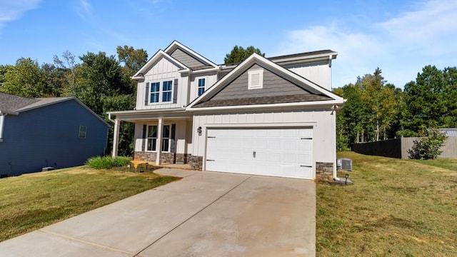 craftsman-style home featuring central AC unit, a front lawn, and covered porch