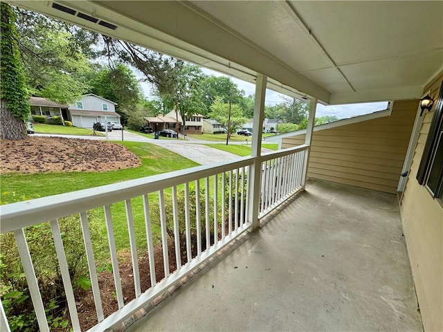 balcony featuring a residential view and covered porch