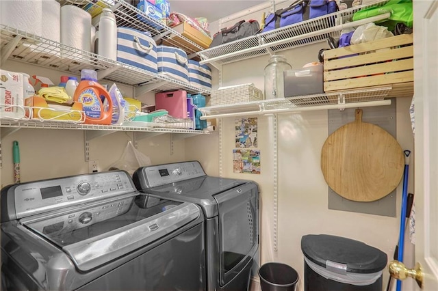 washroom with independent washer and dryer