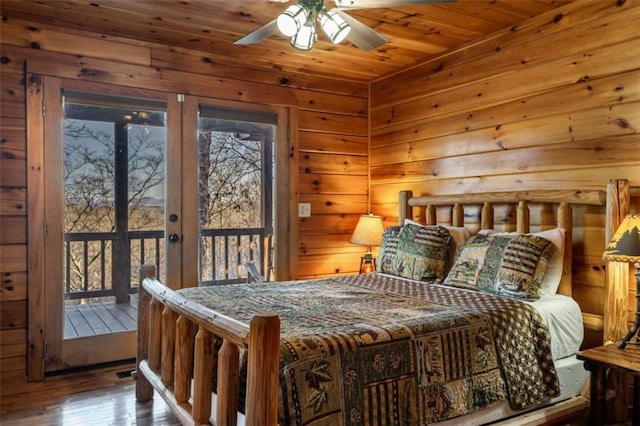 bedroom featuring access to exterior, hardwood / wood-style flooring, french doors, wood walls, and wooden ceiling